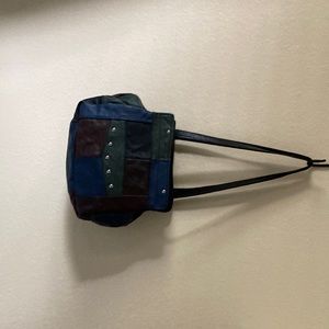 Exquisitely detailed, leather-patchwork bag.